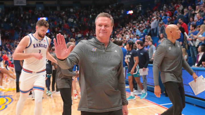 Kansas Jayhawks head coach Bill Self waves towards fans after defeating North Carolina-Wilmington Seahawks 66-84 inside Allen Fieldhouse Tuesday, Nov. 19, 2024.