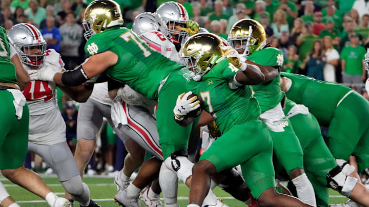 Sep 23, 2023; South Bend, Indiana, USA; Notre Dame Fighting Irish running back Audric Estime (7) carries the ball against Ohio State Buckeyes during the second quarter of their game at Notre Dame Stadium.