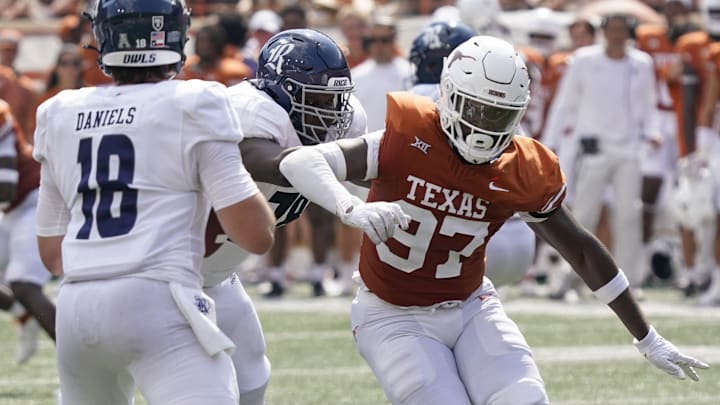 Sep 2, 2023; Austin, Texas, USA; Texas Longhorns  defensive lineman Kristopher Ross (97) rushes quarterback JT Daniels (18) during the first half against the Rice Owls at Darrell K Royal-Texas Memorial Stadium. Mandatory Credit: Scott Wachter-Imagn Images