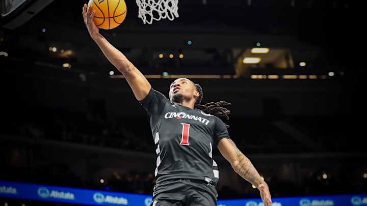 Mar 12, 2025; Kansas City, MO, USA; Cincinnati Bearcats guard Day Day Thomas (1) shoots the ball during the second half against the Cincinnati Bearcats at T-Mobile Center. Mandatory Credit: William Purnell-Imagn Images