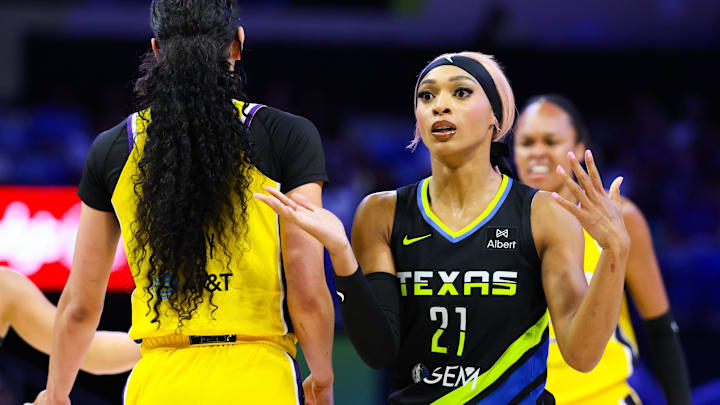 Jun 6, 2025; Arlington, Texas, USA; Dallas Wings guard DiJonai Carrington (21) reacts as Los Angeles Sparks forward Dearica Hamby (5) celebrates during the first half at College Park Center. Mandatory Credit: Kevin Jairaj-Imagn Images Jun 6, 2025; Arlington, Texas, USA; Dallas Wings guard DiJonai Carrington (21) reacts as Los Angeles Sparks forward Dearica Hamby (5) celebrates during the first half at College Park Center. Mandatory Credit: Kevin Jairaj-Imagn Images
