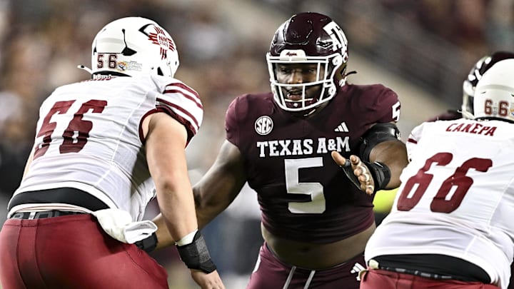 Nov 16, 2024; College Station, Texas, USA; Texas A&M Aggies defensive lineman Shemar Turner (5) defends in coverage against the New Mexico State Aggies during the first half at Kyle Field.