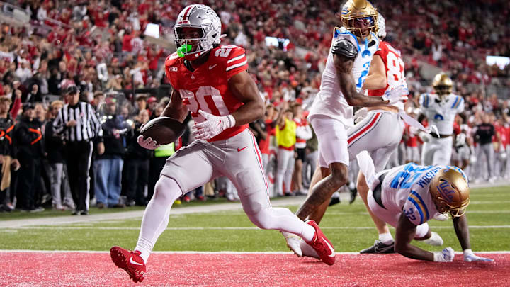 Ohio State Buckeyes running back James Peoples (20) runs for a touchdown during the NCAA football game against the UCLA Bruins at Ohio Stadium in Columbus on Nov. 15, 2025. Ohio State won 48-10.