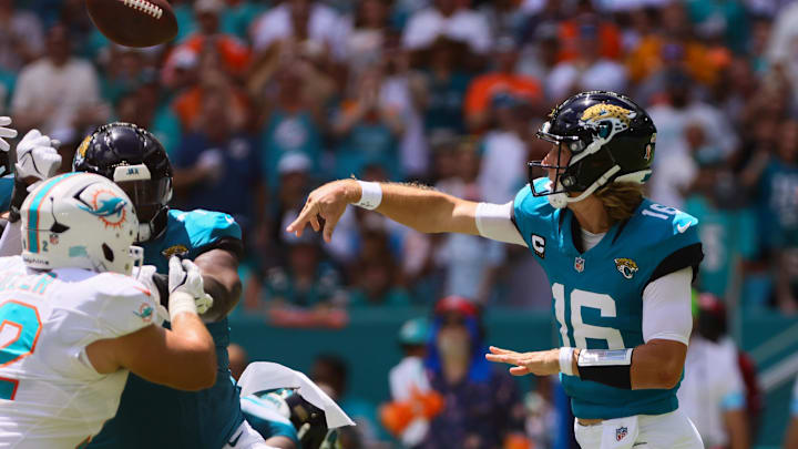 Sep 8, 2024; Miami Gardens, Florida, USA; Jacksonville Jaguars quarterback Trevor Lawrence (16) throws the football against the Miami Dolphins during the first quarter  at Hard Rock Stadium. 