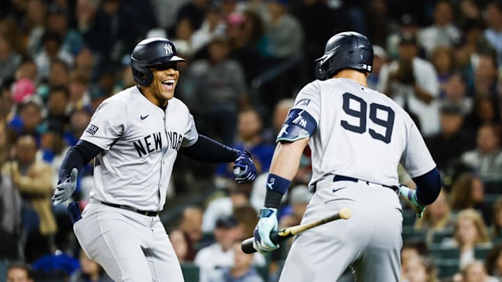 Sep 17, 2024; Seattle, Washington, USA; New York Yankees right fielder Juan Soto (22) celebrates a two-run home run against the Seattle Mariners with designated hitter Aaron Judge (99) during the fourth inning at T-Mobile Park. Mandatory Credit: Joe Nicholson-Imagn Images