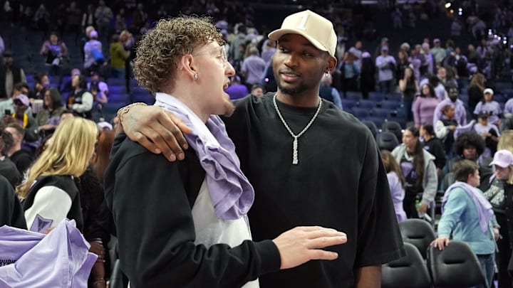 May 16, 2025; San Francisco, California, USA; Golden State Warriors guard Brandin Podziemski (left) and Jonathan Kuminga (right) talk after the game between the Golden State Valkyries and the Los Angeles Sparks at Chase Center. Mandatory Credit: Darren Yamashita-Imagn Images May 16, 2025; San Francisco, California, USA; Golden State Warriors guard Brandin Podziemski (left) and Jonathan Kuminga (right) talk after the game between the Golden State Valkyries and the Los Angeles Sparks at Chase Center. Mandatory Credit: Darren Yamashita-Imagn Images