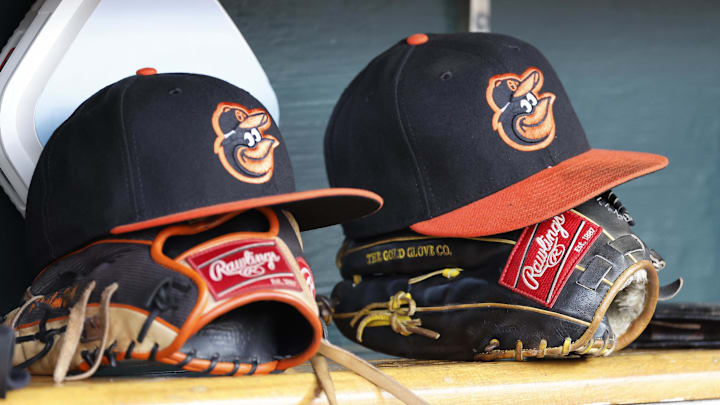 Apr 27, 2023; Detroit, Michigan, USA; Baltimore Orioles hats and glove sits in dugout in the second inning against the Detroit Tigers at Comerica Park. Mandatory Credit: Rick Osentoski-Imagn Images Apr 27, 2023; Detroit, Michigan, USA; Baltimore Orioles hats and glove sits in dugout in the second inning against the Detroit Tigers at Comerica Park. Mandatory Credit: Rick Osentoski-Imagn Images