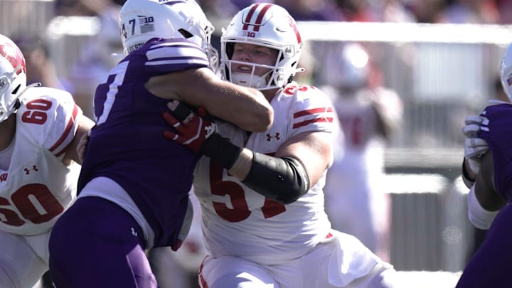 Wisconsin offensive lineman Jake Renfro (57) blocks Northwestern defensive lineman Michael Kilbane (47) during the fourth quarter of their game Saturday October 19, 2024 at Lanny and Sharon Martin Stadium in Evanston, Illinois. Wisconsin beat Northwestern 23-3.