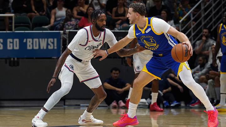 Oct 4, 2026; Honolulu, Hawaii, USA; (Editors Notes: Caption Correction)  Golden State Warriors guard Brandin Podziemski (2) dribbles against Los Angeles Clippers forward Derrick Jones Jr. (5) during the second quarter at Bankoh Arena at the Stan Sheriff Center.  Mandatory Credit: Michelle Bir-Imagn Images
