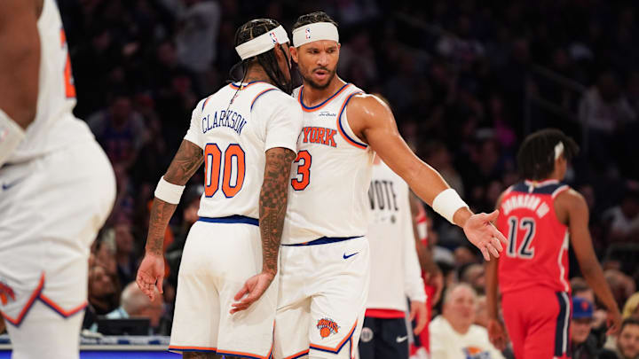 Nov 3, 2025; New York, New York, USA; New York Knicks guard Jordan Clarkson (00) celebrates with New York Knicks guard Josh Hart (3) after scoring a three pointer during the second half against the Washington Wizards at Madison Square Garden. Mandatory Credit: Lucas Boland-Imagn Images