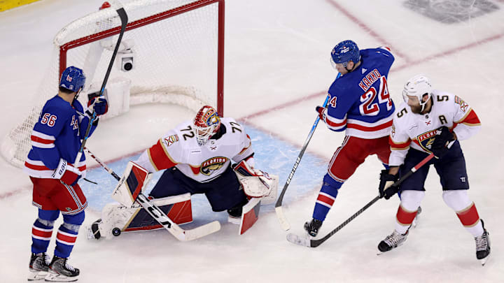 May 30, 2024; New York, New York, USA; Florida Panthers goaltender Sergei Bobrovsky (72) makes a save in front of New York Rangers defenseman Erik Gustafsson (56) and right wing Kaapo Kakko (24) during the third period of game five of the Eastern Conference Final of the 2024 Stanley Cup Playoffs at Madison Square Garden. Mandatory Credit: Brad Penner-USA TODAY Sports