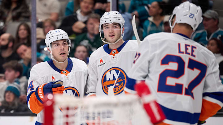 Mar 8, 2025; San Jose, California, USA; New York Islanders center Kyle Palmieri (21), defenseman Noah Dobson (8) and left wing Anders Lee (27) celebrate after a goal against the San Jose Sharks during the first period at SAP Center at San Jose. Mandatory Credit: Robert Edwards-Imagn Images