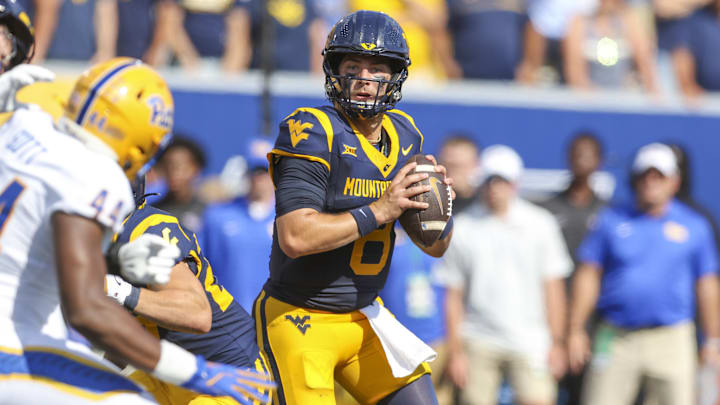 Sep 13, 2025; Morgantown, West Virginia, USA; West Virginia Mountaineers quarterback Nicco Marchiol (8) drops back to pass during the first quarter against the Pittsburgh Panthers at Milan Puskar Stadium. Mandatory Credit: Ben Queen-Imagn Images