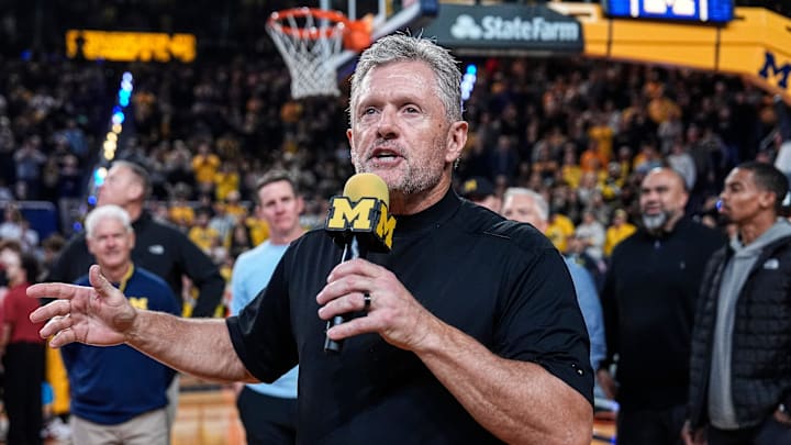 Michigan football head coach Kyle Whittingham speaks as he is being introduced on the floor during the first half between Michigan and USC at Crisler Center in Ann Arbor on Friday, Jan. 2, 2026.