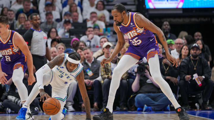 Apr 23, 2024; Minneapolis, Minnesota, USA; Phoenix Suns forward Kevin Durant (35) defends the Minnesota Timberwolves forward Jaden McDaniels (3) in the second quarter during game two of the first round for the 2024 NBA playoffs at Target Center. Mandatory Credit: Brad Rempel-USA TODAY Sports Apr 23, 2024; Minneapolis, Minnesota, USA; Phoenix Suns forward Kevin Durant (35) defends the Minnesota Timberwolves forward Jaden McDaniels (3) in the second quarter during game two of the first round for the 2024 NBA playoffs at Target Center. Mandatory Credit: Brad Rempel-USA TODAY Sports