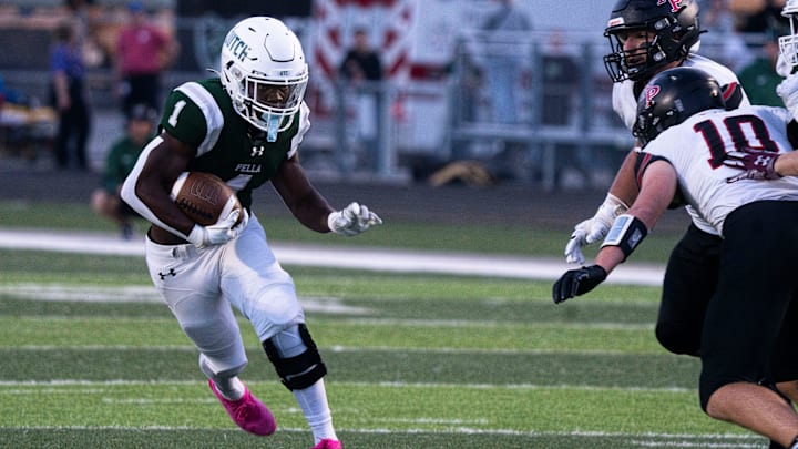 Pella's Emmanuel Diers runs the ball at Pella High School on Friday, Sept. 19, 2025, in Pella.