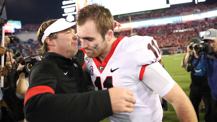 Nov 2, 2019; Jacksonville, FL, USA; Georgia Bulldogs head coach Kirby Smart celebrates with quarterback Jake Fromm (11) after the game against the Florida Gators at TIAA Bank Field. Mandatory Credit: Matt Stamey-Imagn Images