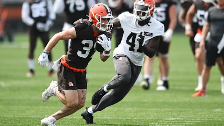 Jun 12, 2025; Berea, OH, USA; Cleveland Browns wide receiver Luke Floriea (37) runs with the ball ask safety Chris Edmonds (41) defends during mini camp at CrossCountry Mortgage Campus. Mandatory Credit: Ken Blaze-Imagn Images