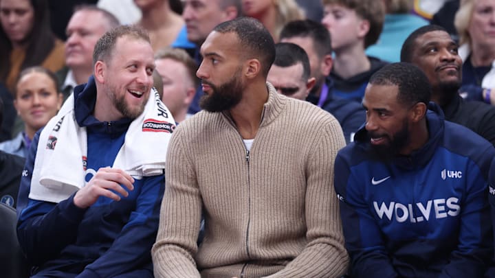 Feb 28, 2025; Salt Lake City, Utah, USA; Three former Utah Jazz players sit on the Minnesota Timberwolves bench from left to right guard Joe Ingles, center Rudy Gobert and guard Mike Conley during the second quarter at Delta Center. Mandatory Credit: Rob Gray-Imagn Images