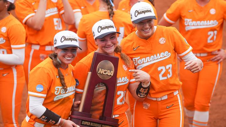 Tennessee outfielder Gabby Leach (55), Tennessee utility Ella Dodge (25) and Tennessee pitcher Karlyn Pickens (23) pose with the trophy after winning a NCAA super regional game between Tennessee and Georgia, advancing to the Women’s College World Series at Sherri Parker Lee Stadium in Knoxville, Tenn., on May 22, 2026. Tennessee outfielder Gabby Leach (55), Tennessee utility Ella Dodge (25) and Tennessee pitcher Karlyn Pickens (23) pose with the trophy after winning a NCAA super regional game between Tennessee and Georgia, advancing to the Women’s College World Series at Sherri Parker Lee Stadium in Knoxville, Tenn., on May 22, 2026.
