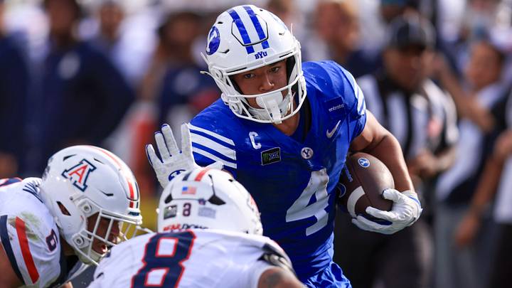 Sep 12, 2026; Provo, Utah, USA; BYU Cougars running back Lj Martin (4) runs the ball against the Arizona Wildcats during the second half at LaVell Edwards Stadium. Mandatory Credit: Rob Gray-Imagn Images Sep 12, 2026; Provo, Utah, USA; BYU Cougars running back Lj Martin (4) runs the ball against the Arizona Wildcats during the second half at LaVell Edwards Stadium. Mandatory Credit: Rob Gray-Imagn Images