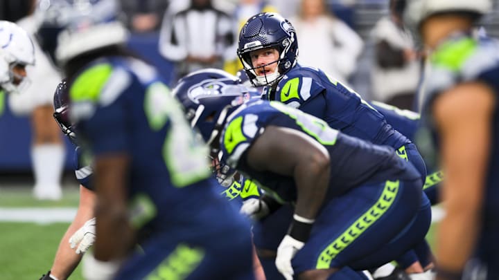 Dec 14, 2025; Seattle, Washington, USA; Seattle Seahawks quarterback Sam Darnold (14) stands over center against the Indianapolis Colts during the fourth quarter at Lumen Field. Dec 14, 2025; Seattle, Washington, USA; Seattle Seahawks quarterback Sam Darnold (14) stands over center against the Indianapolis Colts during the fourth quarter at Lumen Field.