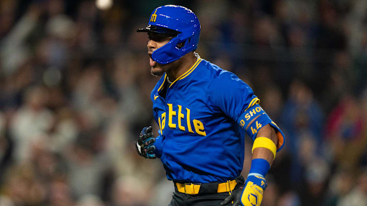 Seattle Mariners center fielder Julio Rodriguez celebrates after hitting a home run against the Texas Rangers on Sept. 11 at T-Mobile Park.