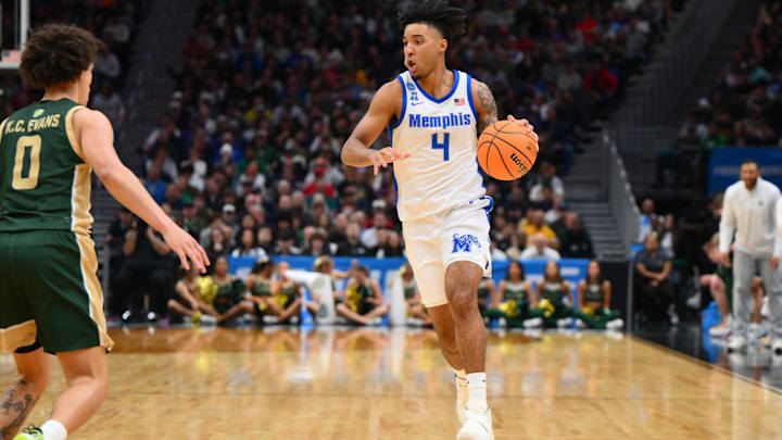 Mar 21, 2025; Seattle, WA, USA; Memphis Tigers guard PJ Haggerty (4) drives the ball during the second half against Colorado State Rams at Climate Pledge Arena. Mandatory Credit: Steven Bisig-Imagn Images