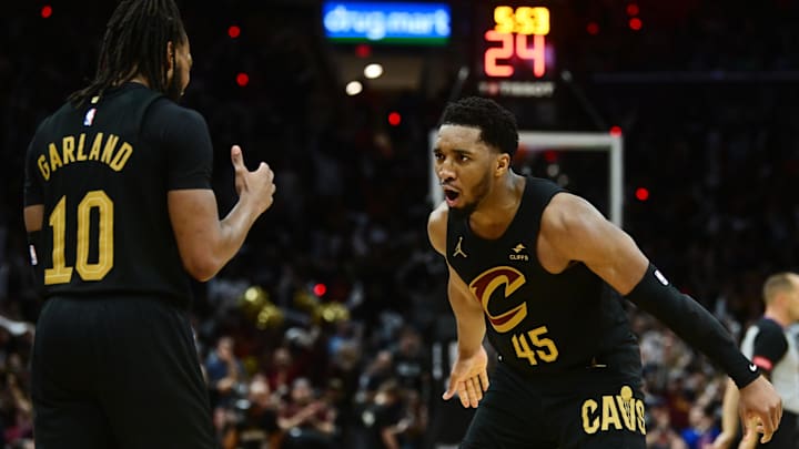 May 5, 2024; Cleveland, Ohio, USA; Cleveland Cavaliers guard Donovan Mitchell (45) celebrates with guard Darius Garland (10) after Garland hit a three point basket during the second half against the Orlando Magic in game seven of the first round for the 2024 NBA playoffs at Rocket Mortgage FieldHouse. Mandatory Credit: Ken Blaze-Imagn Images