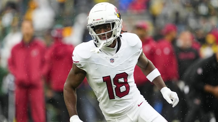 Oct 13, 2024; Green Bay, Wisconsin, USA; Arizona Cardinals wide receiver Marvin Harrison Jr. (18) during warmups prior to the game against the Green Bay Packers at Lambeau Field. Mandatory Credit: Jeff Hanisch-Imagn Images Oct 13, 2024; Green Bay, Wisconsin, USA; Arizona Cardinals wide receiver Marvin Harrison Jr. (18) during warmups prior to the game against the Green Bay Packers at Lambeau Field. Mandatory Credit: Jeff Hanisch-Imagn Images