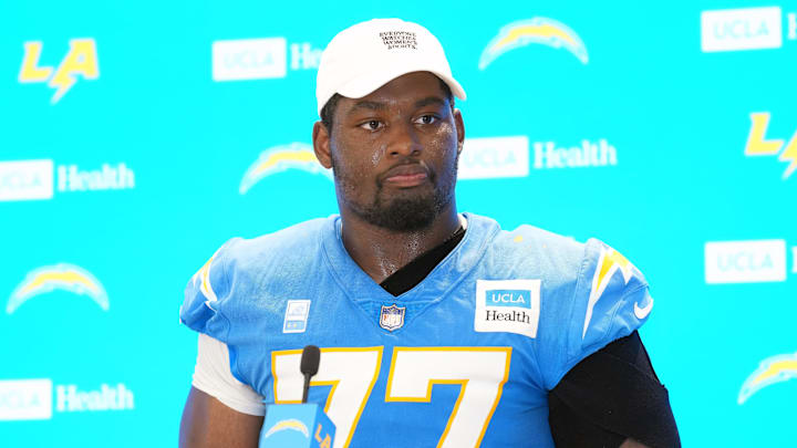 Jul 25, 2025; El Segundo, CA, USA; Los Angeles Chargers guard Zion Johnson (77) during training camp press conference at The Bolt. Mandatory Credit: Kirby Lee-Imagn Images