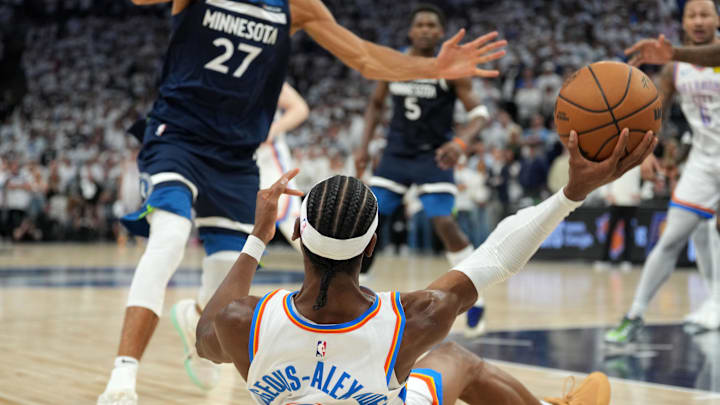 May 26, 2025; Minneapolis, Minnesota, USA; Oklahoma City Thunder guard Shai Gilgeous-Alexander (2) gets a rebound against the Minnesota Timberwolves during game four of the western conference finals for the 2025 NBA Playoffs at Target Center. Mandatory Credit: Jesse Johnson-Imagn Images