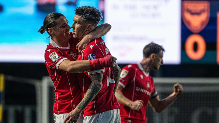 Josh Windass (right) secured all three points for Wrexham.