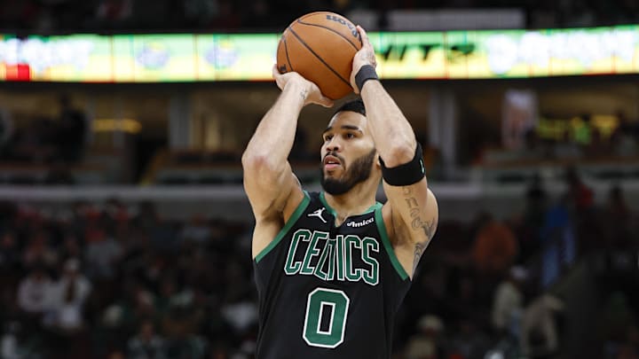 Boston Celtics forward Jayson Tatum (0) shoots against the Chicago Bulls during the second half at United Center.