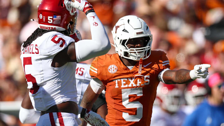 Oct 11, 2025; Dallas, Texas, USA;  Texas Longhorns running back Quintrevion Wisner (5) reacts in front of Oklahoma Sooners linebacker Kendal Daniels (5) during the game at the Cotton Bowl. Mandatory Credit: Kevin Jairaj-Imagn Images