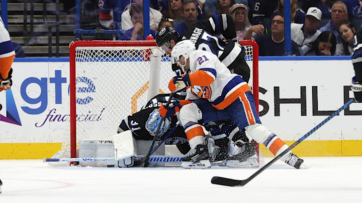 Mar 29, 2025; Tampa, Florida, USA; New York Islanders center Kyle Palmieri (21) shoots as Tampa Bay Lightning goaltender Jonas Johansson (31) makes a save during the second period at Amalie Arena. Mandatory Credit: Kim Klement Neitzel-Imagn Images