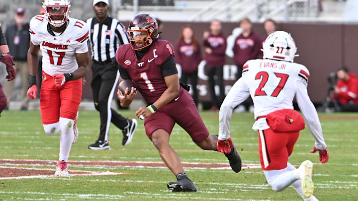 Nov 1, 2025; Blacksburg, Va.; Virginia Tech quarterback Kyron Drones (1) runs the ball. Nov 1, 2025; Blacksburg, Va.; Virginia Tech quarterback Kyron Drones (1) runs the ball.