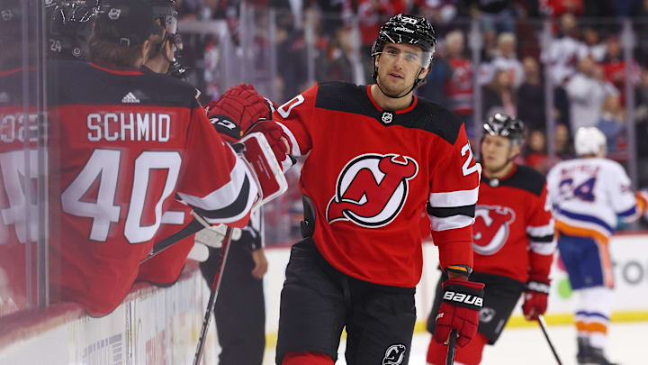 Nov 28, 2023; Newark, New Jersey, USA; New Jersey Devils center Michael McLeod (20) celebrates his goal against the New York Islanders during the first period at Prudential Center. Mandatory Credit: Ed Mulholland-Imagn Images