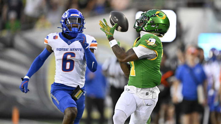 Sep 7, 2024; Eugene, Oregon, USA; Oregon Ducks wide receiver Evan Stewart (7) catches a pass for a first down during the first half against Boise State Broncos cornerback Jeremiah Earby (6) at Autzen Stadium.