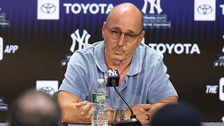 Aug 23, 2023; Bronx, New York, USA; New York Yankees general manager Brian Cashman talks with the