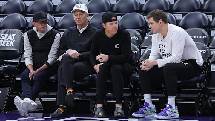 Feb 6, 2024; Salt Lake City, Utah, USA; From left to right, Utah Jazz general manager Justin Zanik, CEO Danny Ainge, owner Ryan Smith and head coach Will Hardy sit court side before the game between the Utah Jazz and the Oklahoma City Thunder at Delta Center. Mandatory Credit: Rob Gray-Imagn Images
