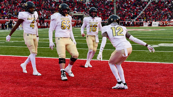 Nov 25, 2023; Salt Lake City, Utah, USA; Colorado Buffaloes athlete Travis Hunter (12) does a touchdown dance in the end zone against the Utah Utes at Rice-Eccles Stadium. Mandatory Credit: Christopher Creveling-Imagn Images