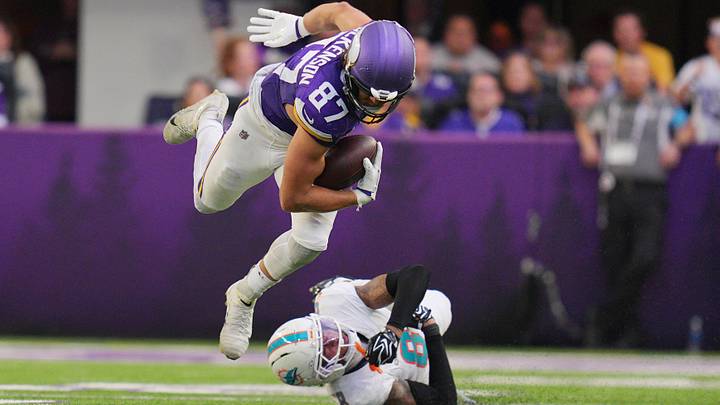 Minnesota Vikings tight end T.J. Hockenson (87) is tackled by Miami Dolphins cornerback Julius Brents (8) during the third quarter at U.S. Bank Stadium.  