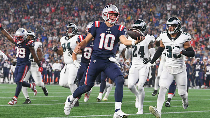Aug 15, 2024; Foxborough, MA, USA; New England Patriots quarterback Drake Maye (10) runs the ball in for a touchdown against the Philadelphia Eagles during the first half at Gillette Stadium.