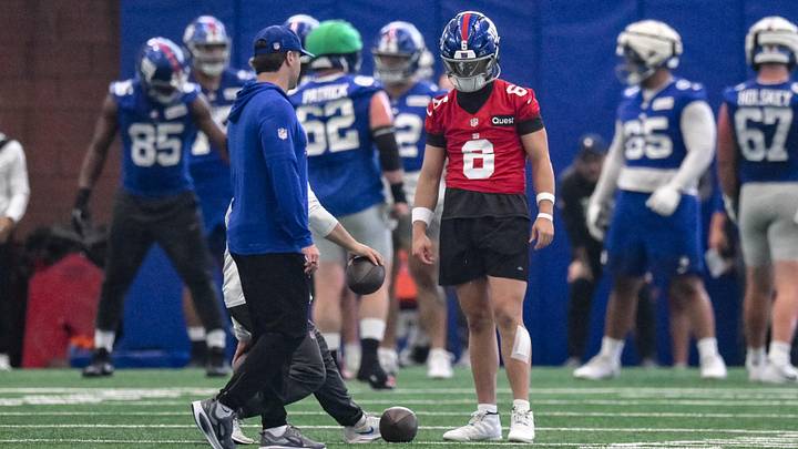 New York Giants quarterback Jaxson Dart (6) participates in a drill during organized team activities at Quest Diagnostics Training Center.  
