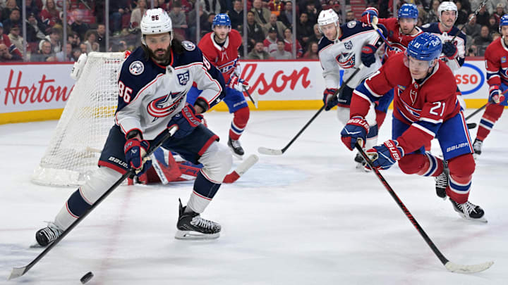 Mar 26, 2026; Montreal, Quebec, CAN; Columbus Blue Jackets forward Kirill Marchenko (86) plays the puck and Montreal Canadiens defenseman Kaiden Guhle (21) defends during the third period at the Bell Centre. Mandatory Credit: Eric Bolte-Imagn Images Mar 26, 2026; Montreal, Quebec, CAN; Columbus Blue Jackets forward Kirill Marchenko (86) plays the puck and Montreal Canadiens defenseman Kaiden Guhle (21) defends during the third period at the Bell Centre. Mandatory Credit: Eric Bolte-Imagn Images