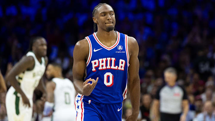 Oct 23, 2024; Philadelphia, Pennsylvania, USA; Philadelphia 76ers guard Tyrese Maxey (0) reacts to his three pointer against the Milwaukee Bucks during the first quarter at Wells Fargo Center. Mandatory Credit: Bill Streicher-Imagn Images