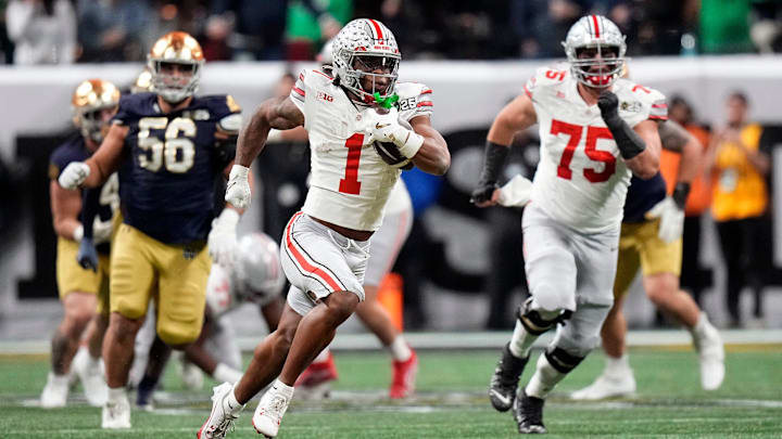 Ohio State Buckeyes running back Quinshon Judkins (1) gets away from the Notre Dame Fighting Irish defense for a long run in the third quarter during the College Football Playoff championship at Mercedes-Benz Stadium in Atlanta on January 20, 2025.