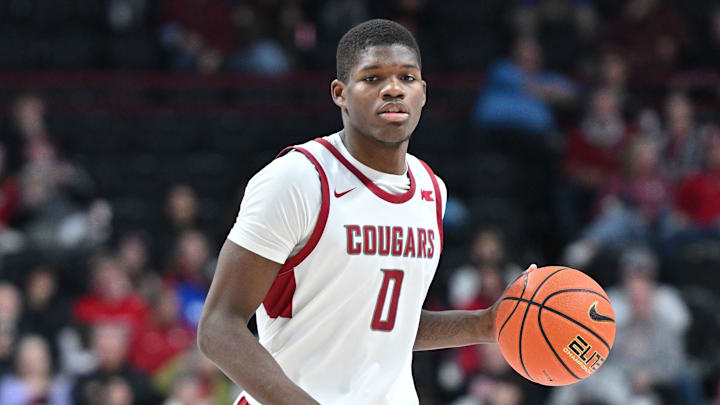 Nov 21, 2024; Spokane, Washington, USA; Washington State Cougars guard Cedric Coward (0) controls the ball against the Eastern Washington Eagles in the second half at Spokane Veterans Memorial Arena. Nov 21, 2024; Spokane, Washington, USA; Washington State Cougars guard Cedric Coward (0) controls the ball against the Eastern Washington Eagles in the second half at Spokane Veterans Memorial Arena.