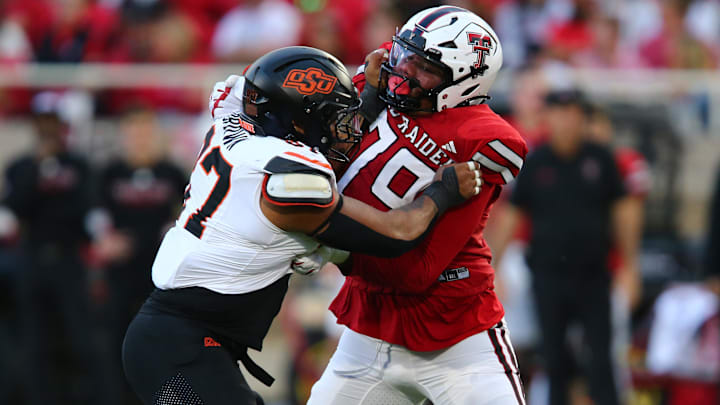 Oct 25, 2025; Lubbock, Texas, USA;  Oklahoma State Cowboys defensive lineman DeSean Brown (87) rushes against Texas Tech Red Raiders offensive lineman Haward Sampson (79) in the second half at Jones AT&T Stadium. Mandatory Credit: Michael C. Johnson-Imagn Images Oct 25, 2025; Lubbock, Texas, USA;  Oklahoma State Cowboys defensive lineman DeSean Brown (87) rushes against Texas Tech Red Raiders offensive lineman Haward Sampson (79) in the second half at Jones AT&T Stadium. Mandatory Credit: Michael C. Johnson-Imagn Images